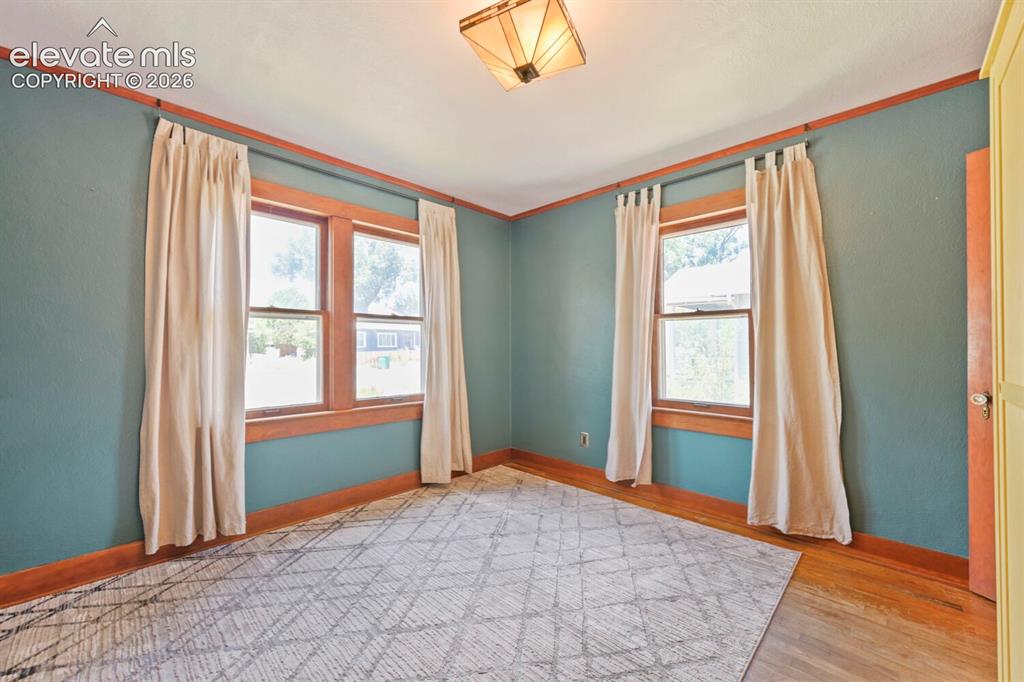 Image 19 of 36: Large bedroom flooded with natural light!