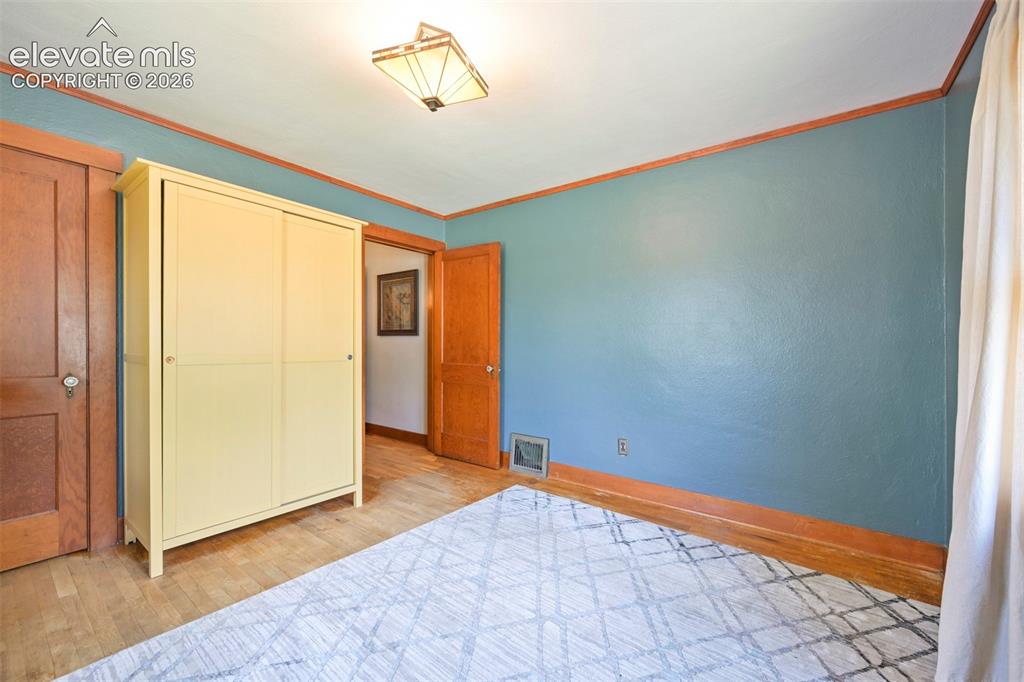 Image 22 of 36: Trul shows how spacious this from bedroom is, and the solid wood closet doo