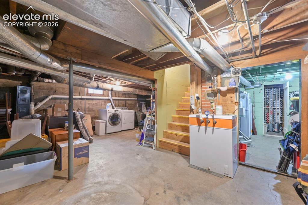 Image 24 of 36: Spacioisly open basement space for storage and laundry!