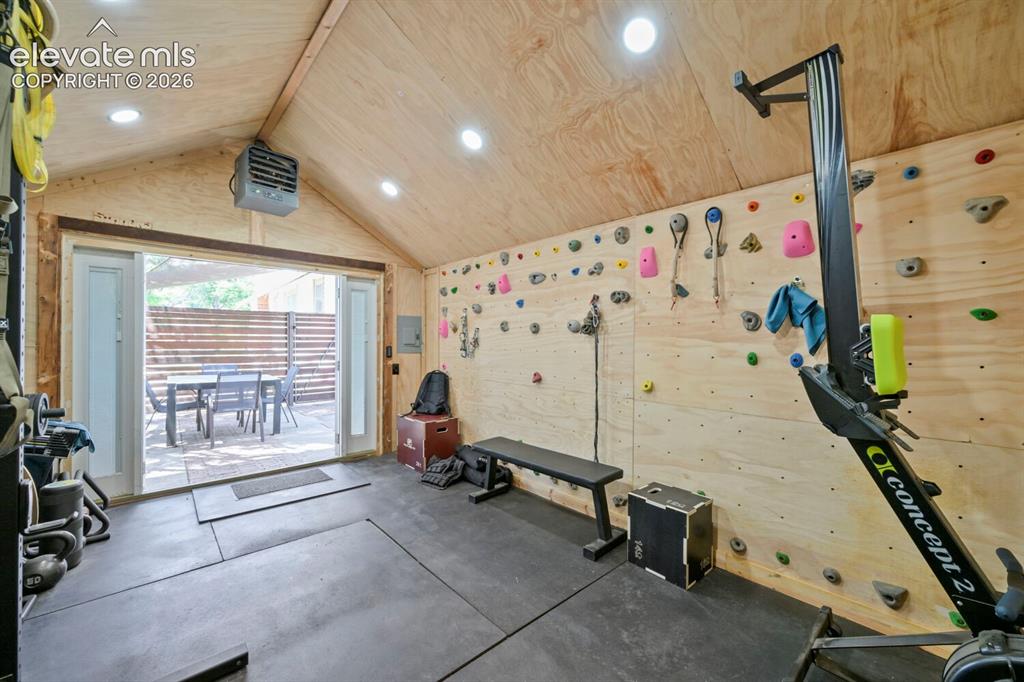 Image 28 of 36: Another view through the gym portion of the repurposed garage space!