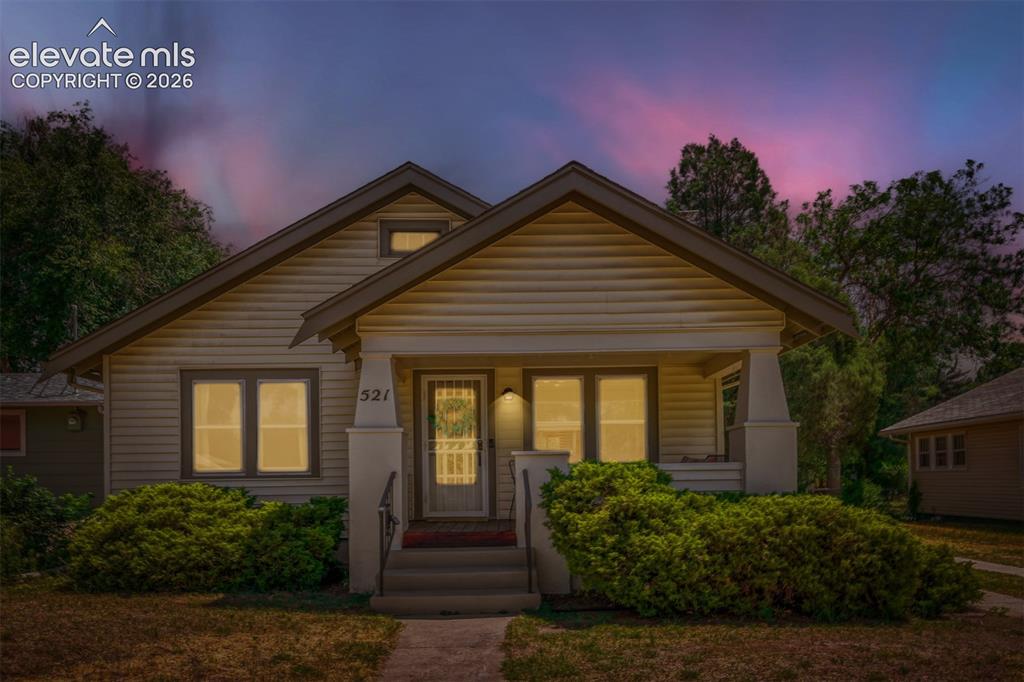 Image 4 of 36: Curb appeal with the evening ambiance!