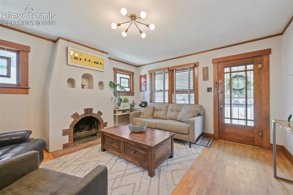 Image 5 of 36: Gorgeous living space with a charming fireplace as the focus!