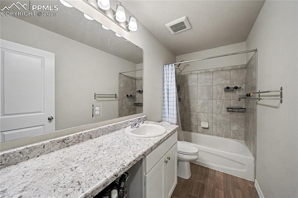 Image 27 of 38: Upstairs Full Bath with Large Vanity Countertop
