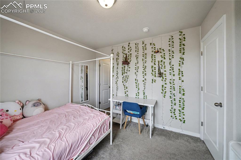 Image 29 of 38: Upstairs Bedroom 3 with walk in closet!