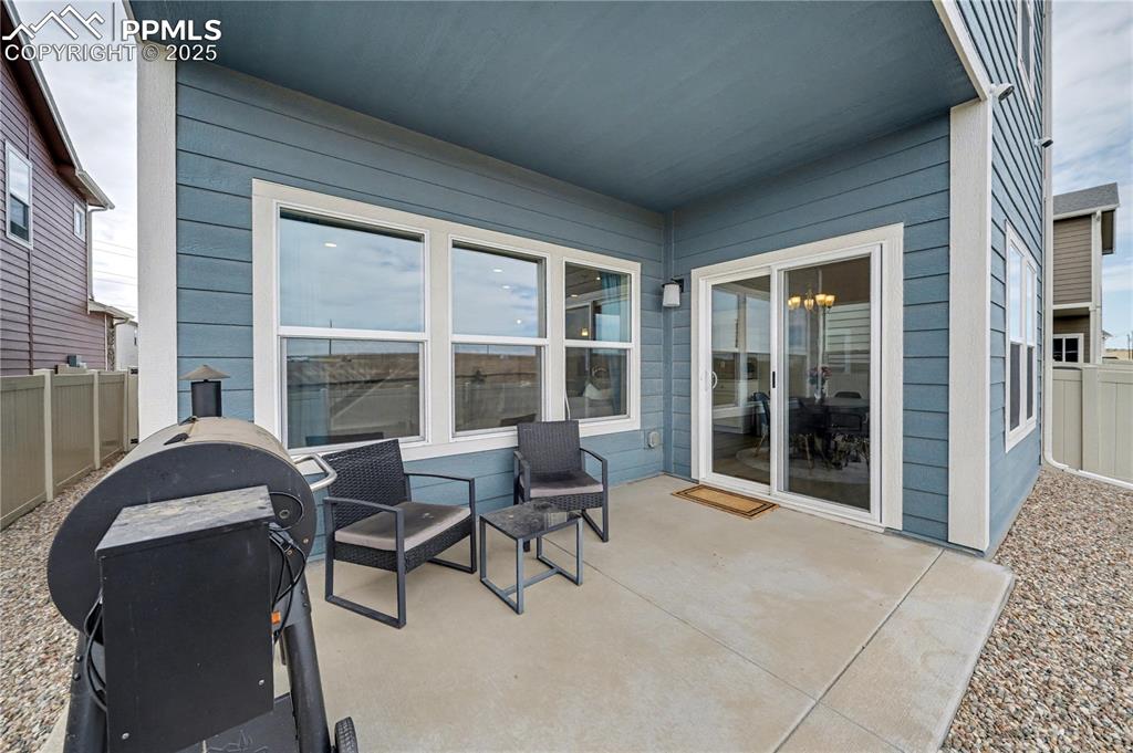 Image 31 of 38: Large covered patio perfect for grilling or entertaining!