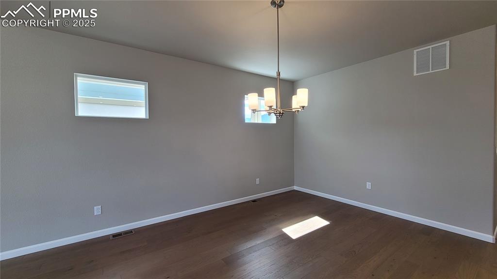 Image 11 of 49: Spacious dining area, perfect for hosting a dinner party!