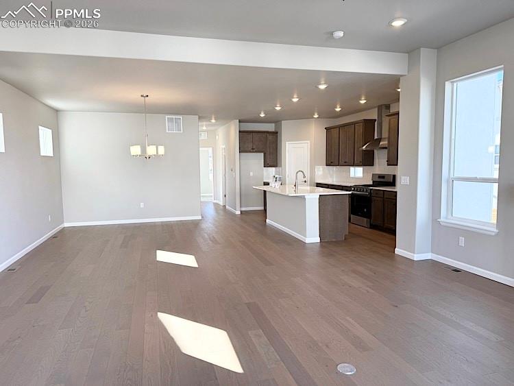 Image 12 of 49: Great Room, Dining Area, and Kitchen