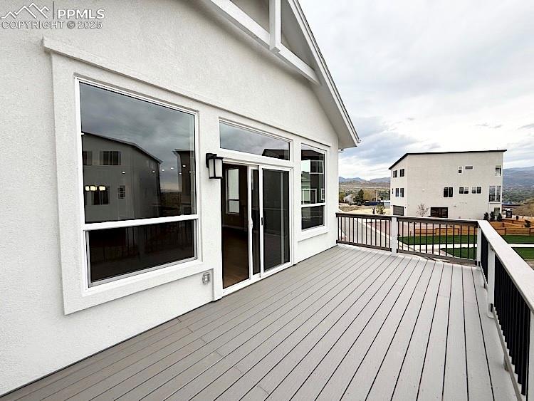 Image 15 of 49: Spacious private deck perfect for hosting gatherings.