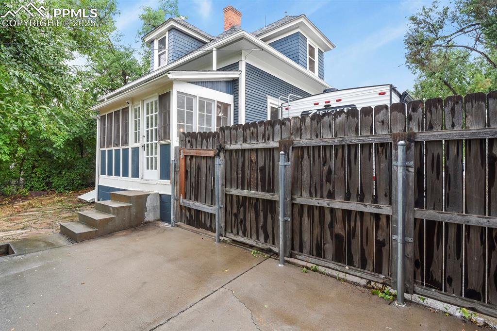 Image 31 of 36: Gate with a patio