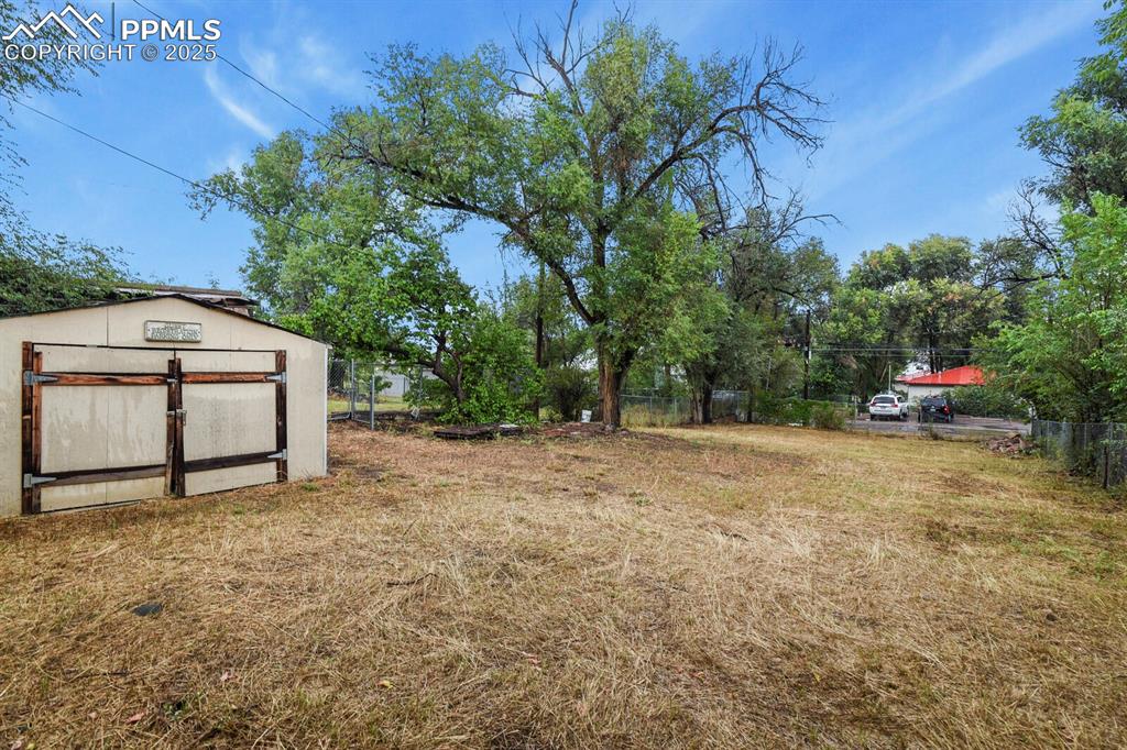 Image 32 of 36: View of yard with a shed