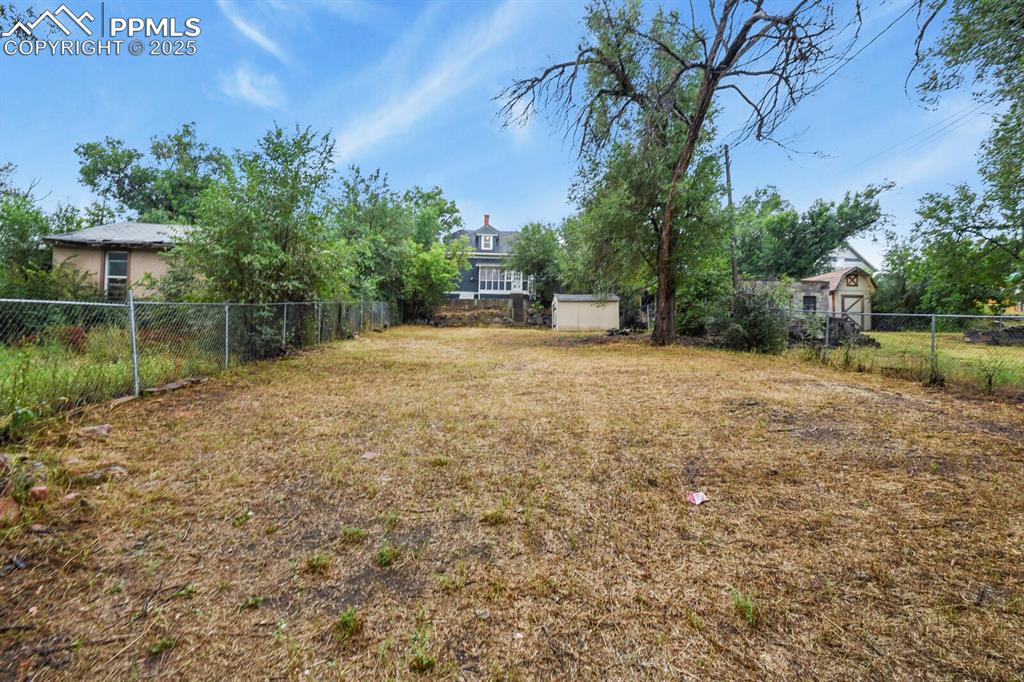 Image 33 of 36: View of yard with an outdoor structure
