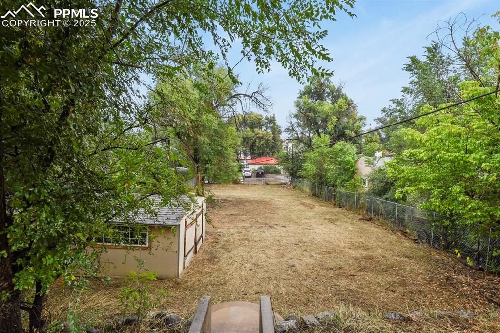Image 34 of 36: View of yard with an outdoor structure
