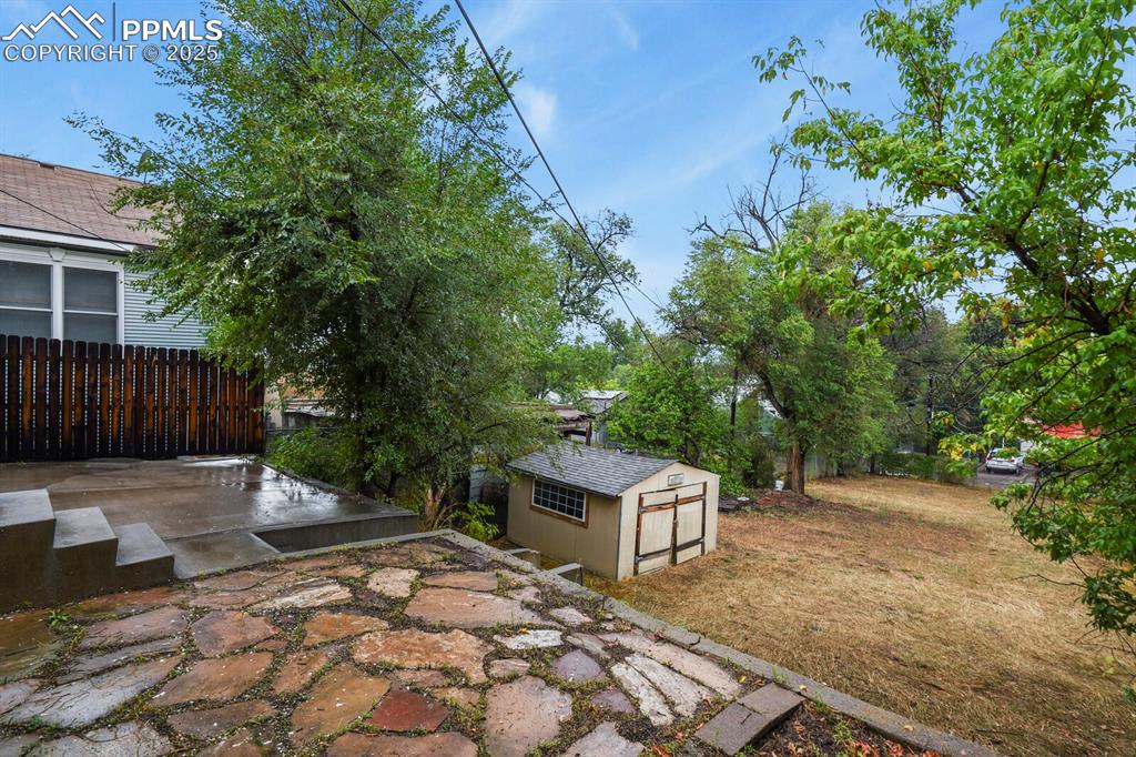 Image 36 of 36: View of patio with a storage unit