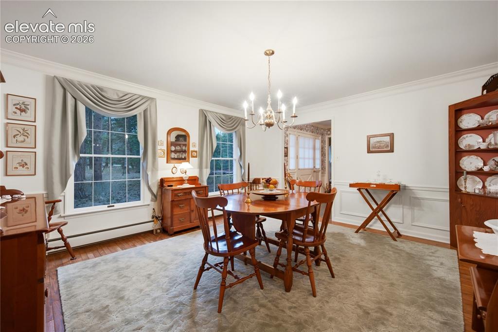 Image 14 of 50: The dining nook flows easily from the retro kitchen and leads directly to t