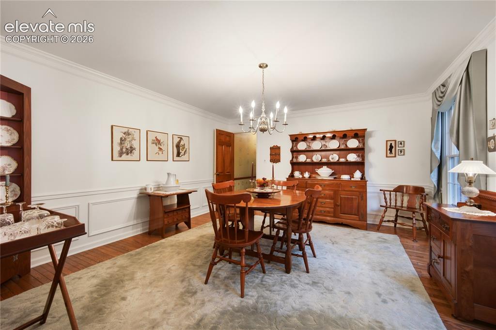 Image 15 of 50: The main-level laundry room is conveniently located and features a utility 