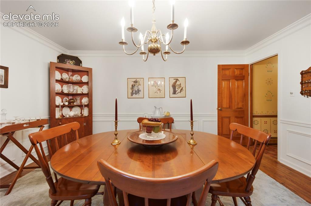 Image 16 of 50: A dedicated pantry and storage room offers extensive shelving right off the