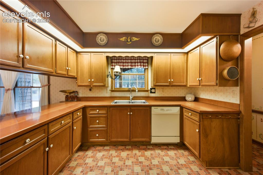 Image 18 of 50: The cozy family room is perfect for entertaining, featuring a massive floor