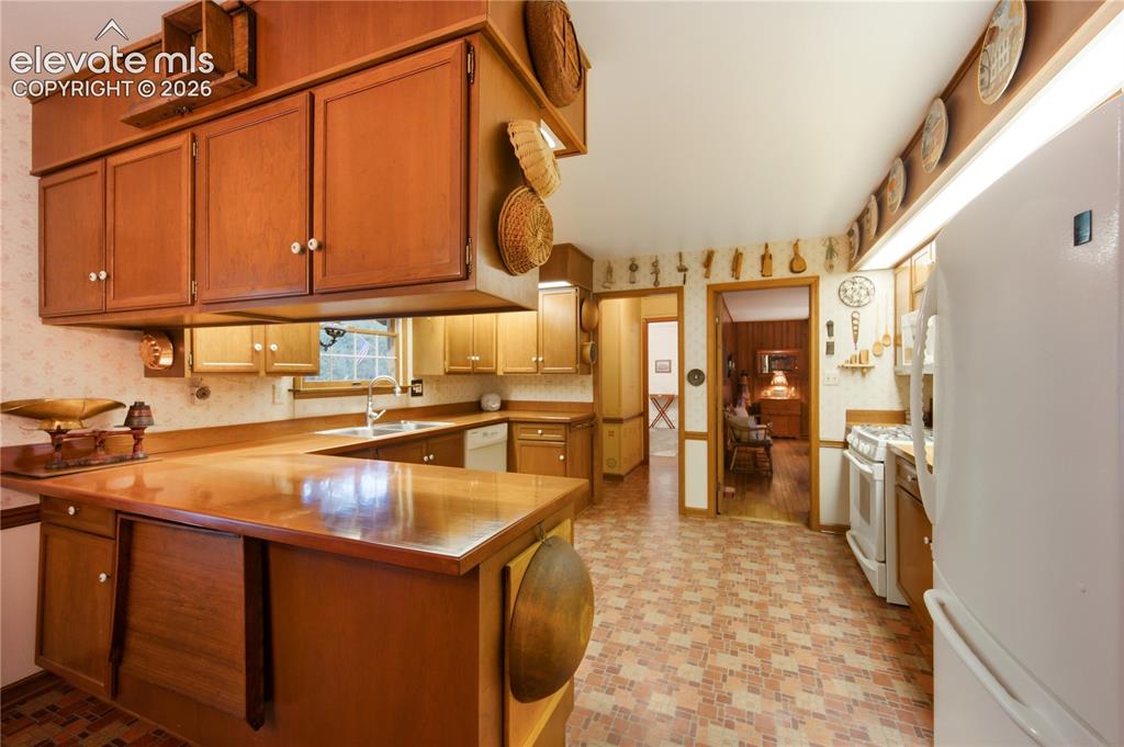 Image 21 of 50: The expansive primary suite includes direct walk-out access to a beautifull