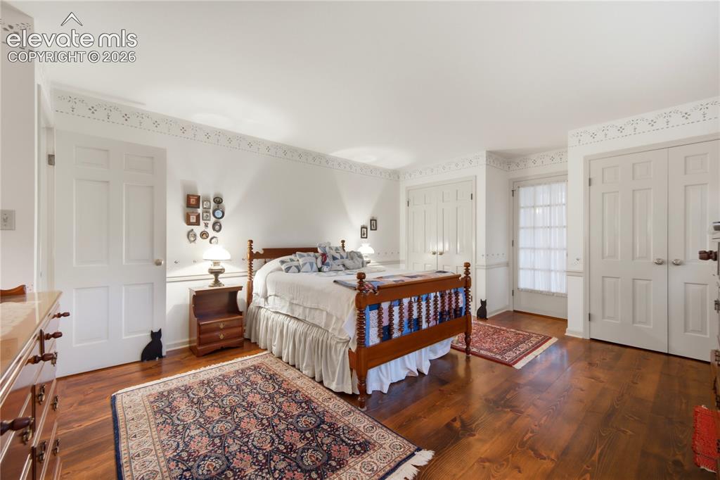 Image 29 of 50: One of the four exceptionally spacious upper-level guest bedrooms features 