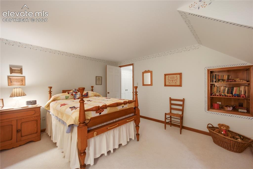 Image 34 of 50: A versatile upper-level room functions beautifully as a hobby space, home o
