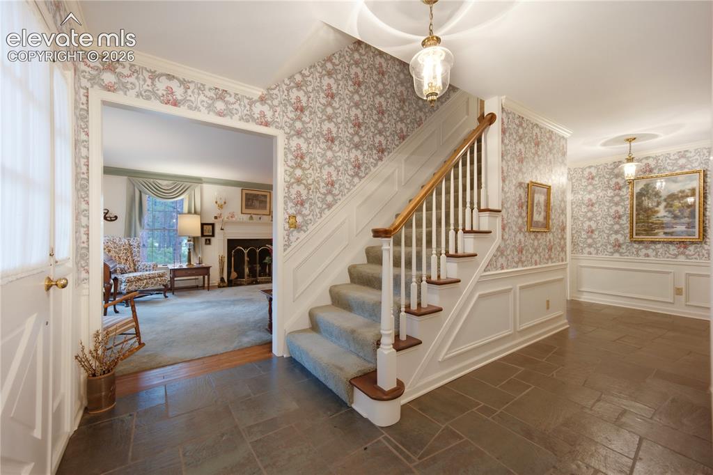 Image 5 of 50: This daytime view of the covered brick porch shows its perfect position for