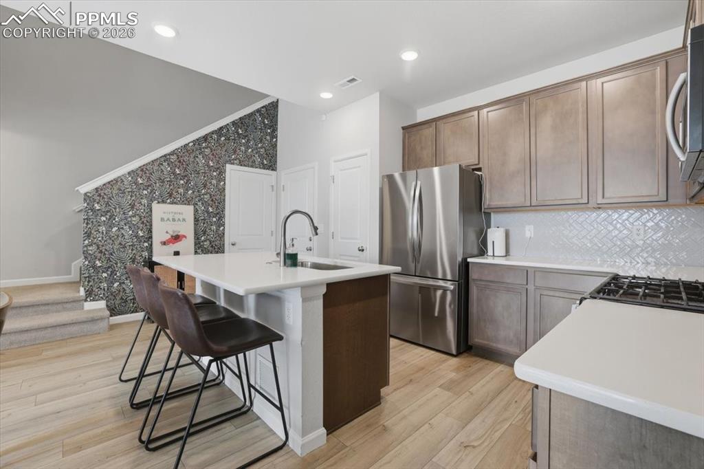 Image 15 of 40: Beautiful kitchen with gas stove.