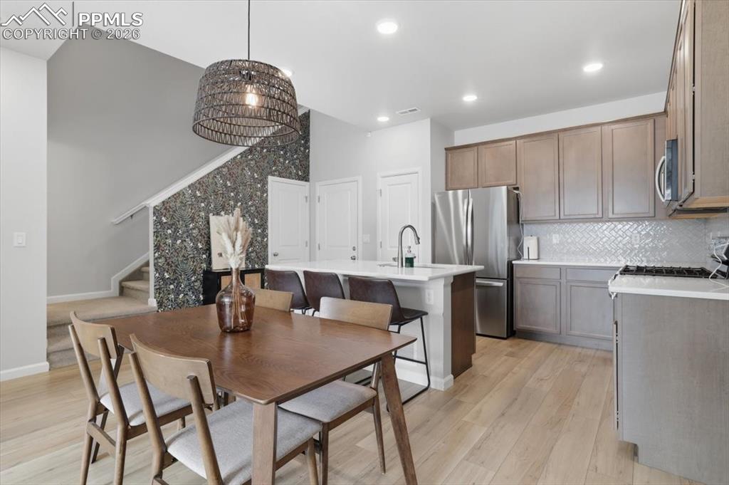 Image 16 of 40: Kitchen and dining area.