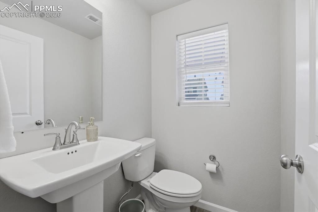 Image 17 of 40: Main level guest bathroom.