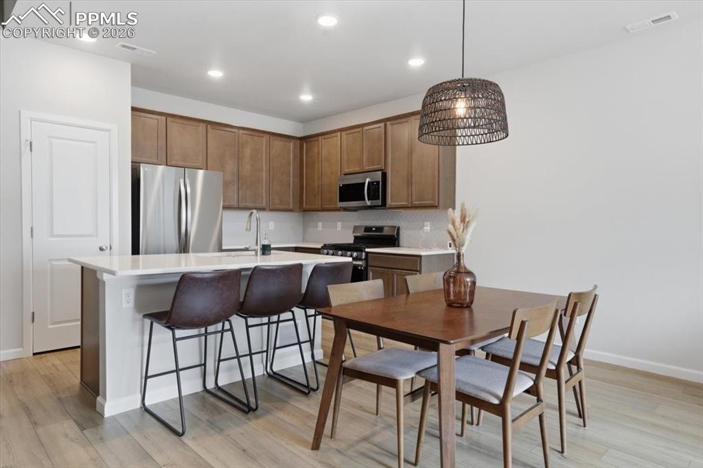Image 9 of 40: Kitchen and dining area.