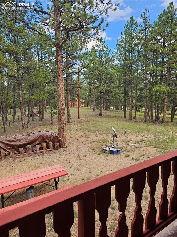 Image 11 of 13: View of yard with view of scattered trees