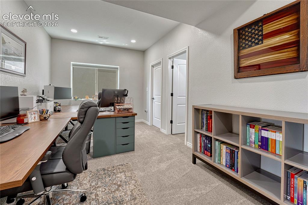 Image 32 of 50: This alternative angle of the newly finished basement office/jr suite bedro