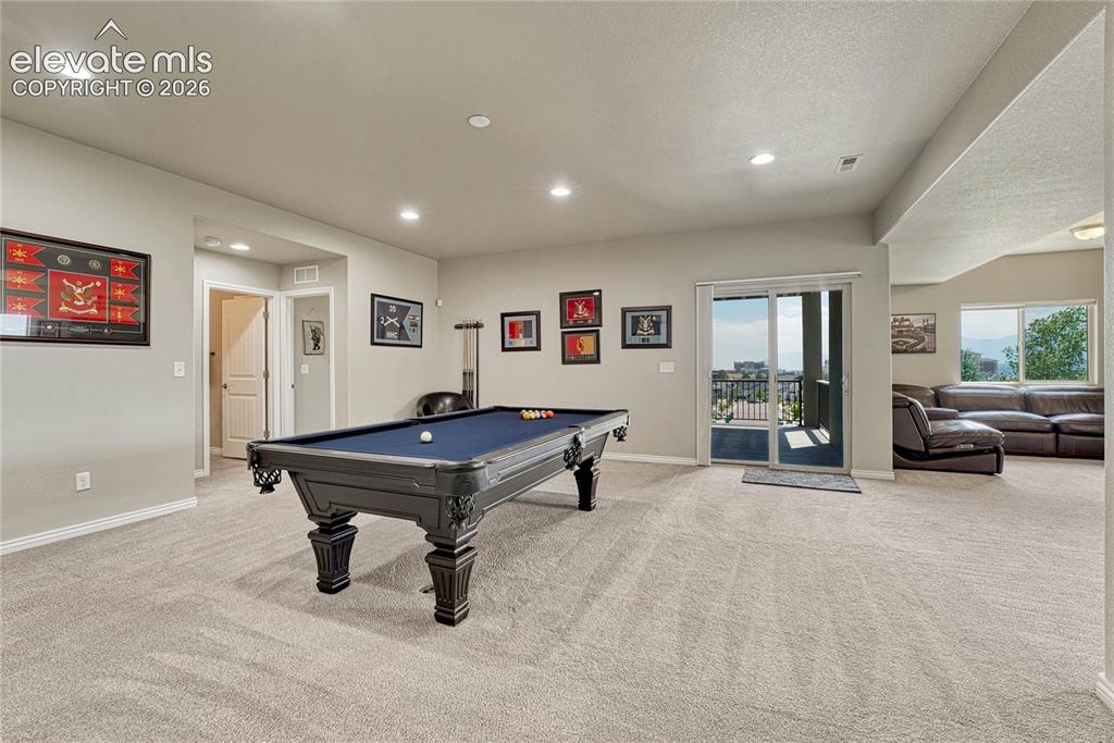 Image 34 of 50: Sliding glass doors from the walk-out basement lead directly to a private l