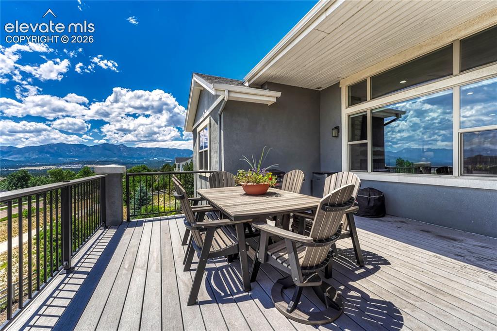Image 41 of 50: The durable, low-maintenance composite decking and black metal railings fra