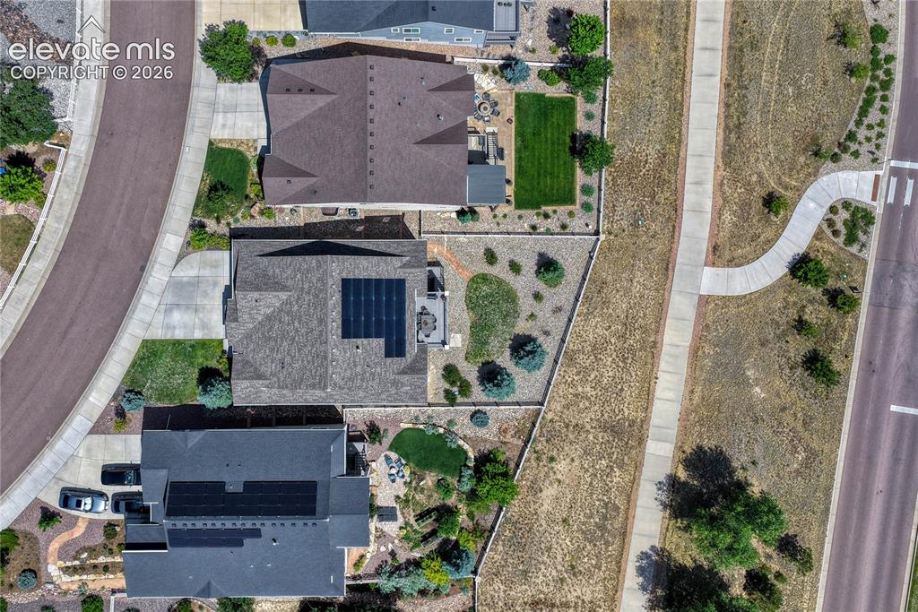 Image 47 of 50: Directly overhead, you can see the paid-in-full, photovoltaic solar panels,