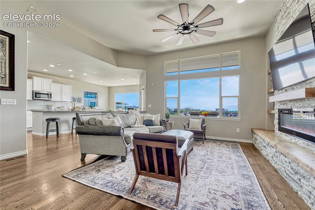 Image 6 of 50: The centerpiece of the great room is a magnificent floor-to-ceiling stacked