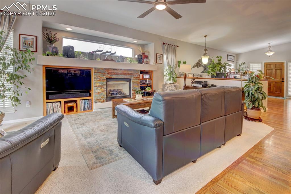 Image 12 of 50: Living room entertainment center and gas fireplace