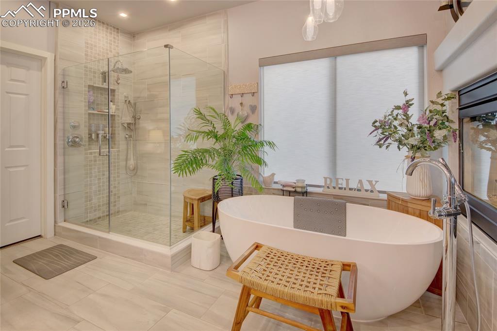Image 19 of 50: Master bathroom spa walk in shower and programable heated tile floors