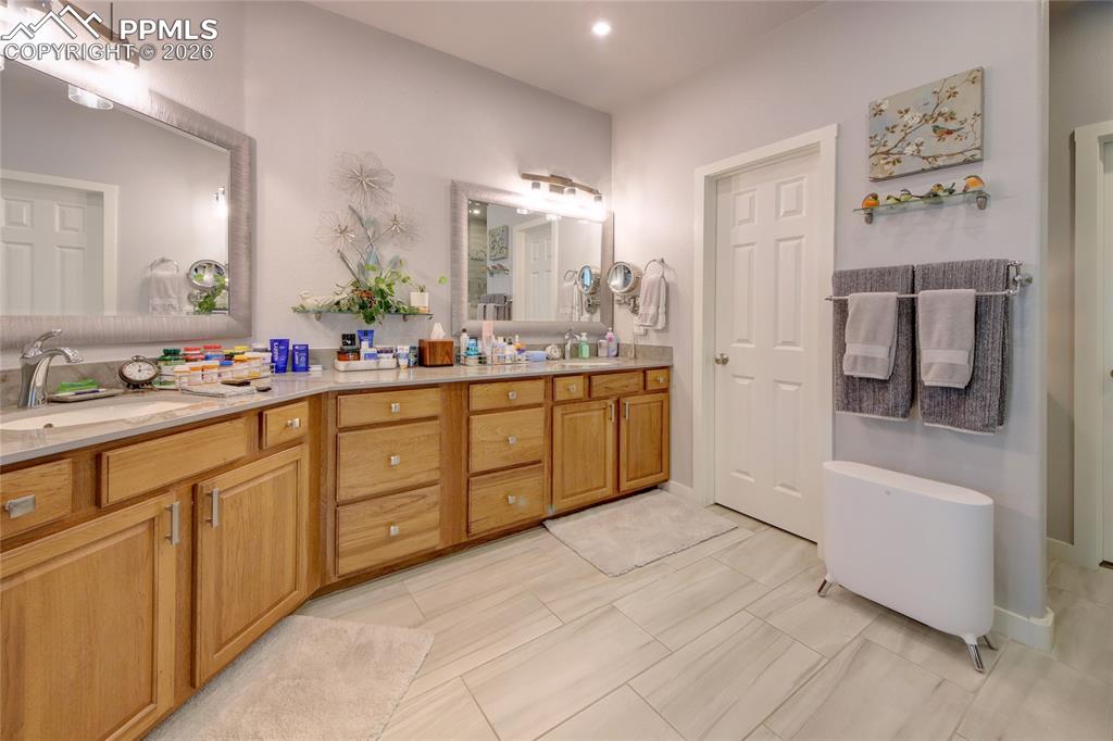 Image 21 of 50: Master bath quartz counters, floating shelves and mirrors, and a coffee bar