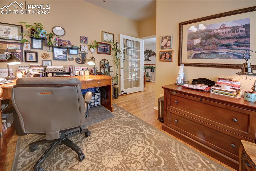 Image 25 of 50: Office on main level with french door entry