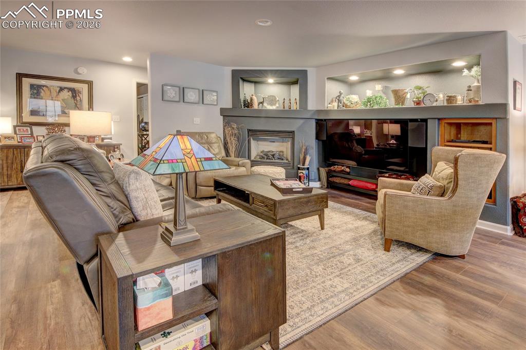 Image 28 of 50: Family room luxury vinyl tile floors