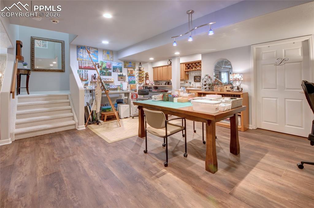 Image 33 of 50: Family room area currently used for arts and crafts