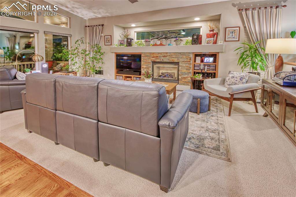 Image 47 of 50: Kitchen lighting spills into living room at night