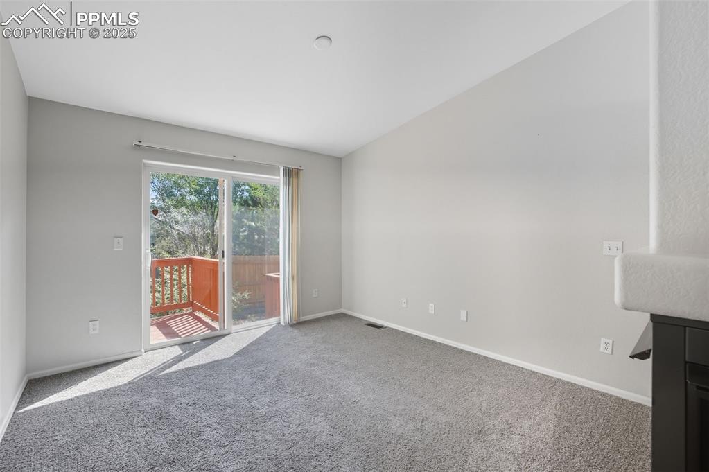 Image 16 of 47: Formal living room/great room with walk out to rear deck