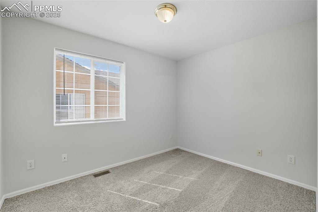 Image 30 of 47: 2nd bedroom on main level