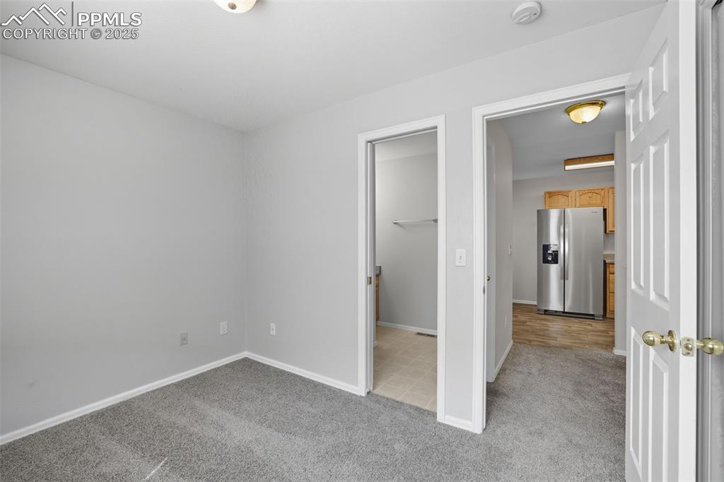 Image 32 of 47: 2nd bedroom with adjoining guest bathroom