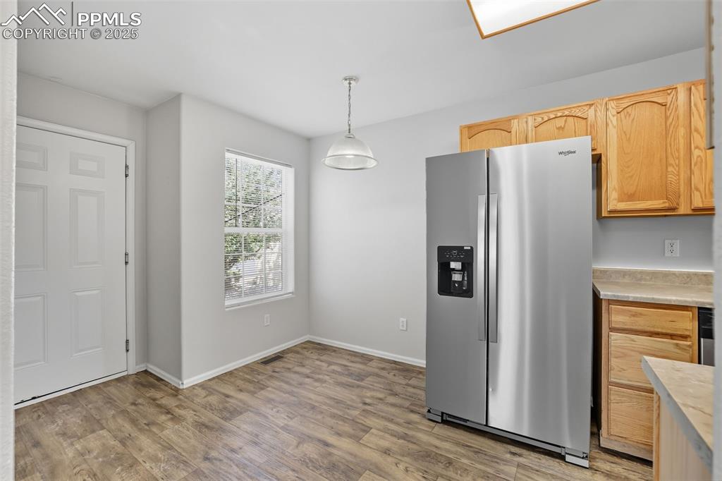 Image 9 of 47: Kitchen with eat in dining area & garage access