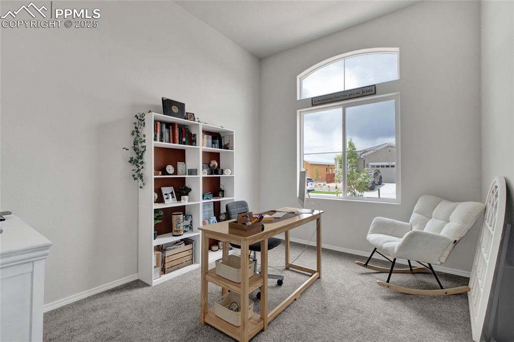 Image 16 of 41: Office space with carpet floors and baseboards