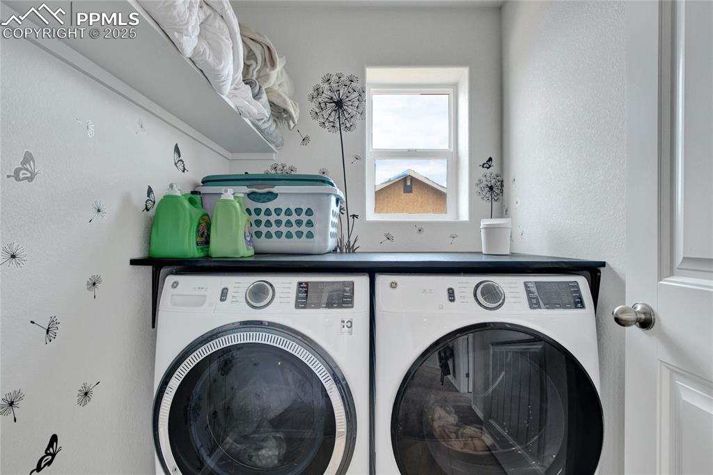 Image 27 of 41: Washroom with separate washer and dryer