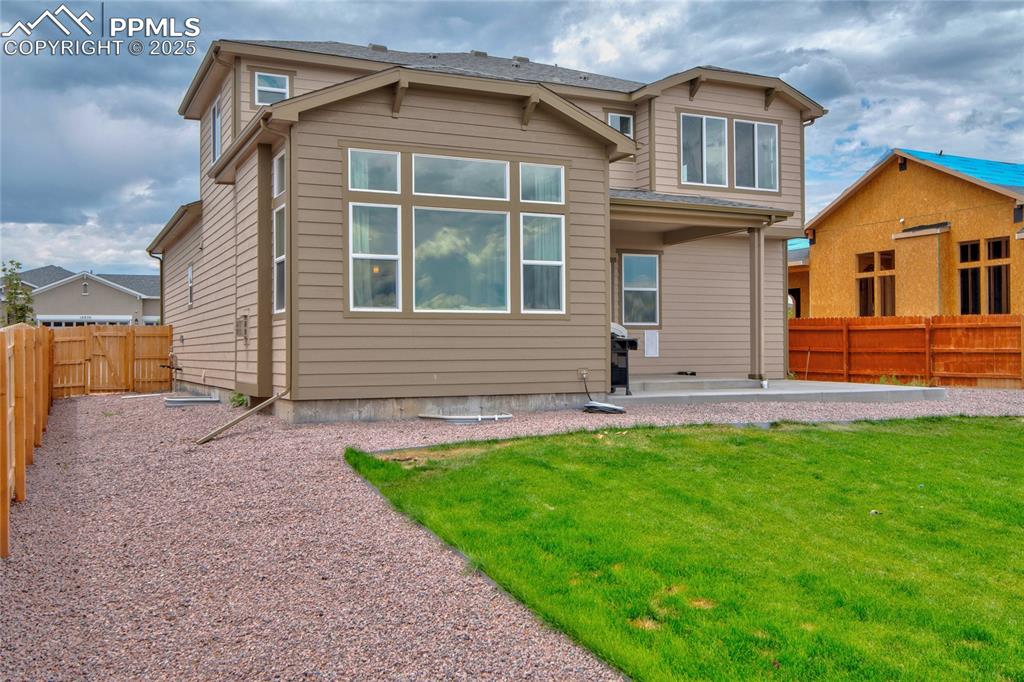 Image 41 of 41: Back of house with a patio area and a fenced backyard