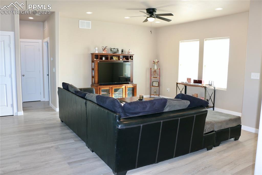 Image 4 of 28: Living room with recessed lighting, light wood-style flooring, and ceiling 